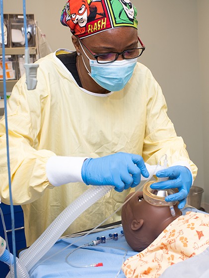 A Nurse Anesthesia student practices in UNE's Interprofessional Simulation and Innovation Center.