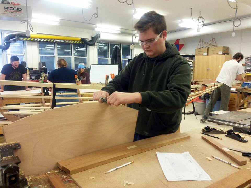 Nathaniel MacLeod ('16) and classmates work on creating individual parts of the boat.