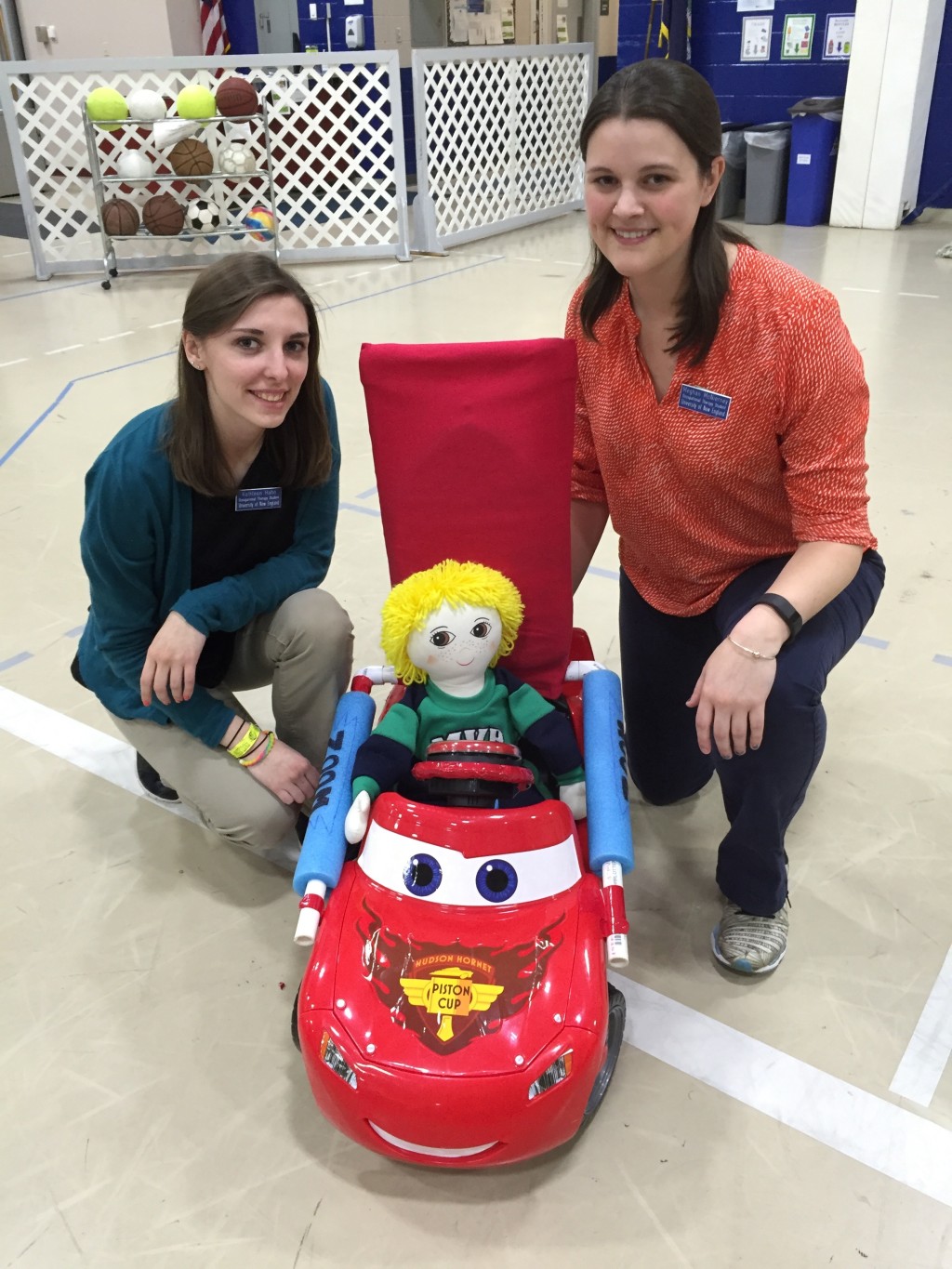 Kati Hahn and Meghan McNierney with the Go Baby Go Car