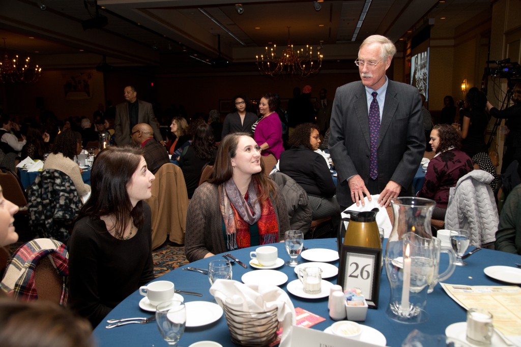 Senator Angus King talks with UNE students during the dinner.