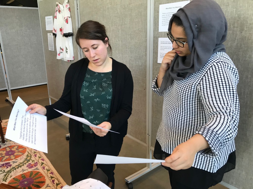 UNE Title IX investigator and prevention specialist Brittany Swett and Hajra Chand discuss placement of a display