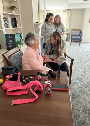 Students perform health screenings for older adults at Bessey Crossing
