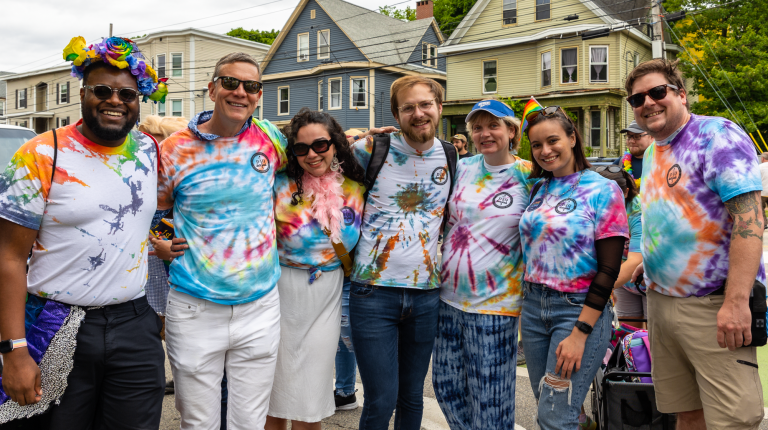 UNE students and President Herbert pose at Pride
