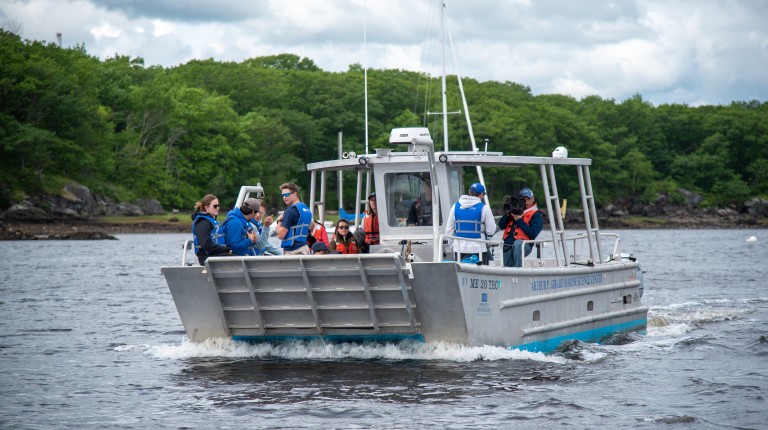 Students and researchers depart from campus on the research boat