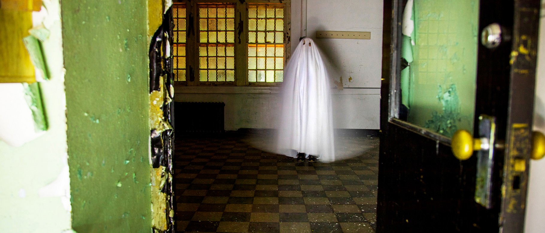 Digital art piece showing white ghost inside empty room