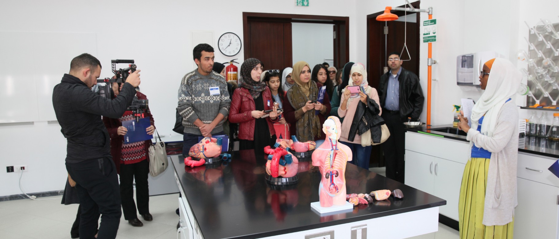 A group of Moroccan students tours a lab on UNE's Tangier campus