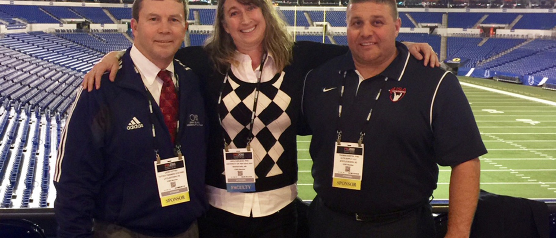 Lara Carlson at Lucas Oil Stadium with Olympic lifting coach Leo Totten and is his former athlete, Tom Martin