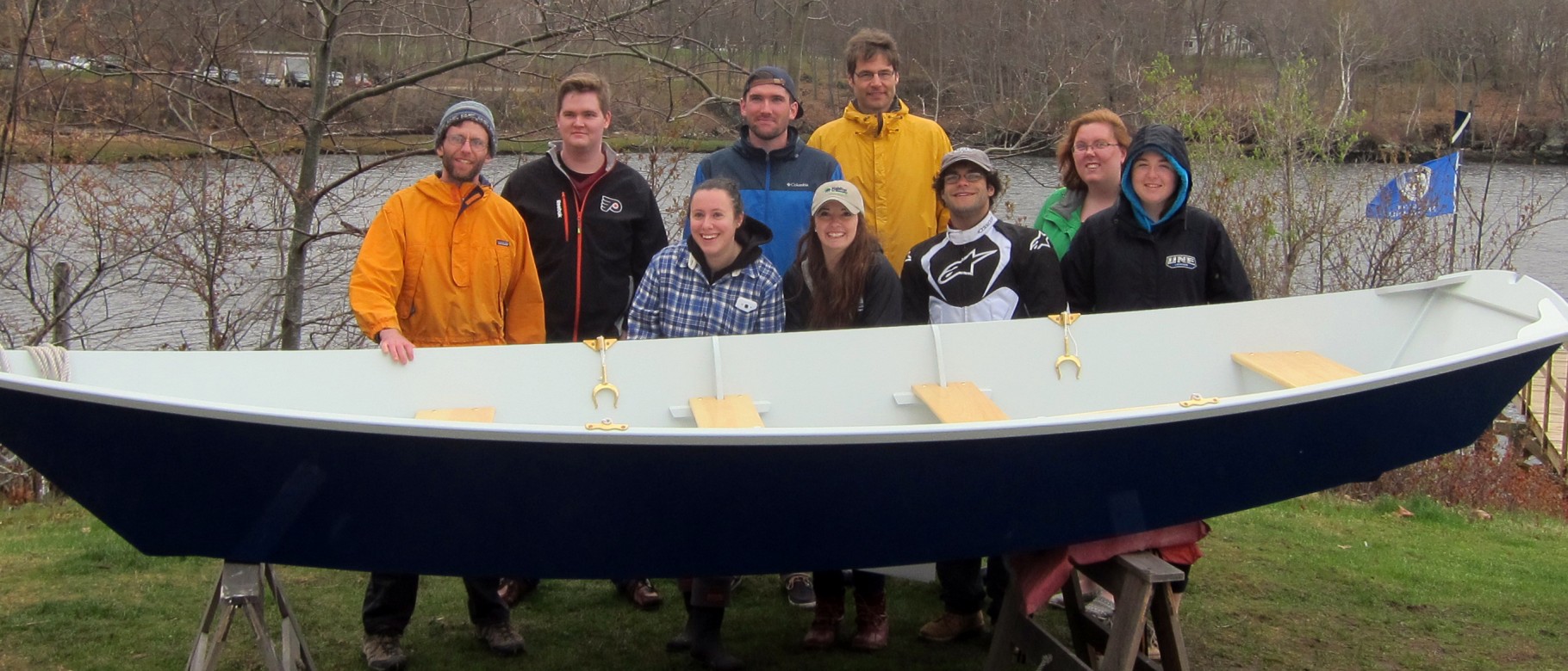 Members of the UNE Boatbuilding course pose with Sea Basket before the launch.