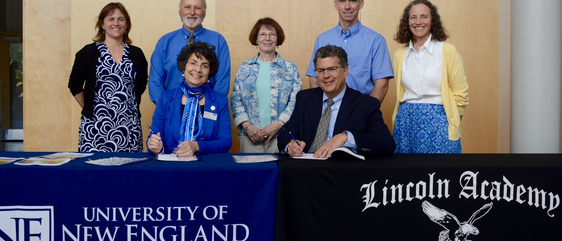 L-R seated: Jeanne Hey, Ph.D., dean of UNE’s College of Arts and Sciences; David Sturdevant, head of school, Lincoln Academy; L-