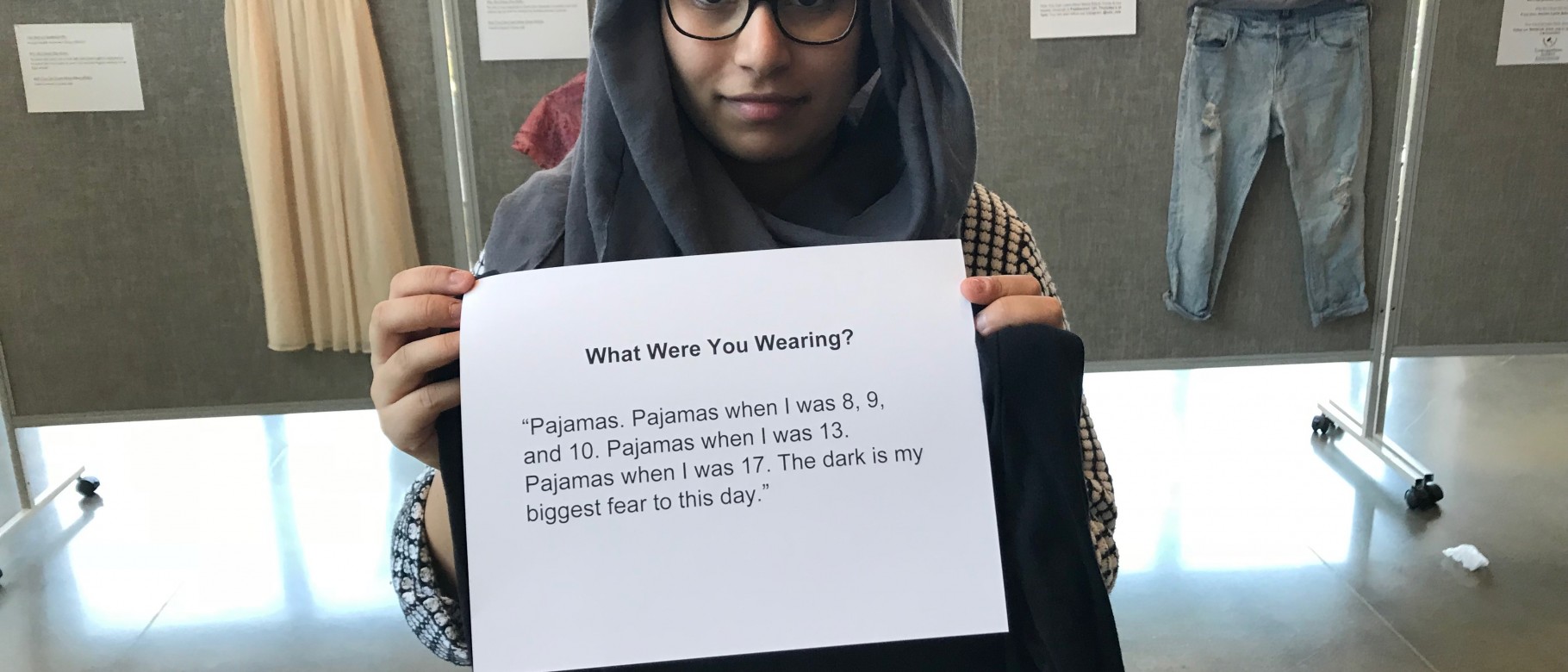 UNE student Hajra Chand helped organizers set up the 'What were you wearing' exhibit