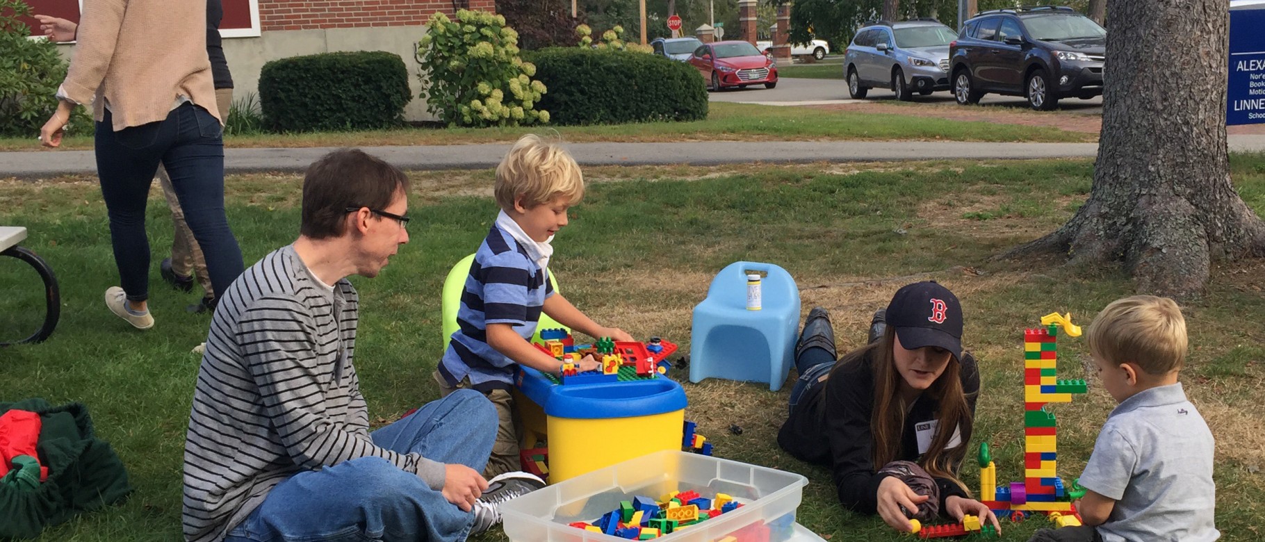 LEND Trainee Matt Pascarella and Lindsey Rose, PT, D.P.T., interact with children at the annual picnic.