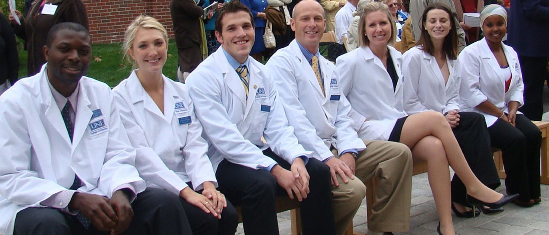 Students from UNE's inaugural class gather at the dedication ceremony for the Pharmacy building in October of 2009. On October 9