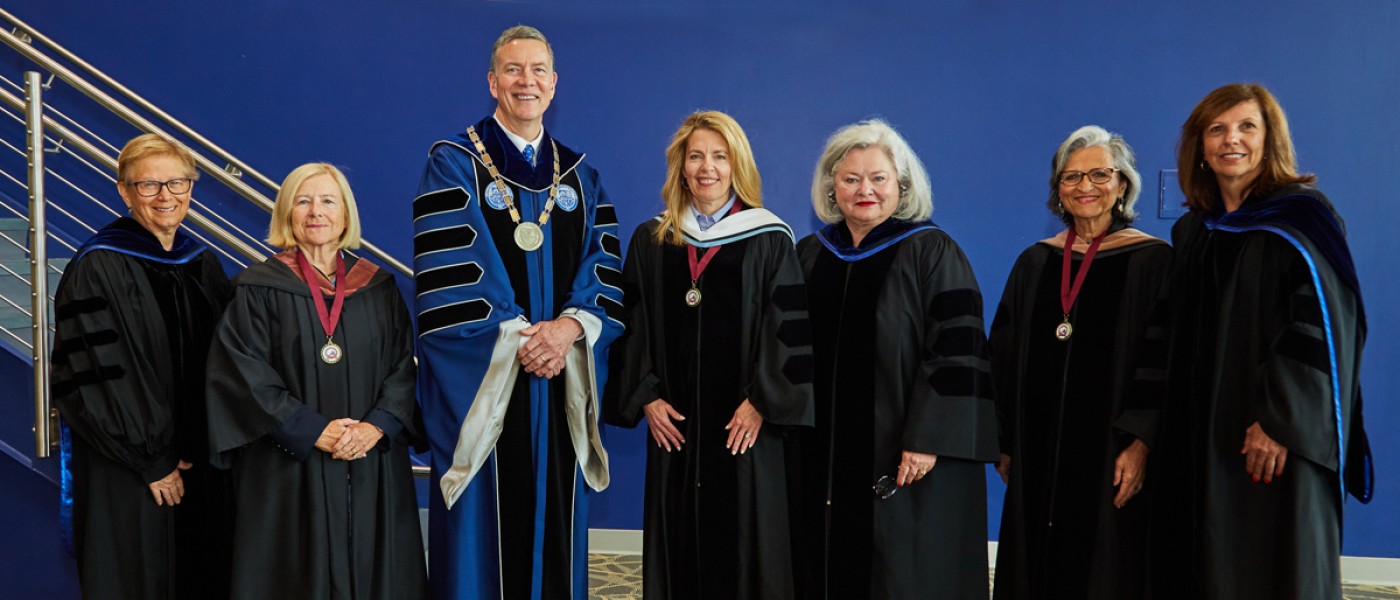 President Herbert stands with the 61st Annual Deborah Morton Society recipients, Melissa Smith, Kathie Leonard, and Cynthia Milliken Taylor, along with other organizers of the event