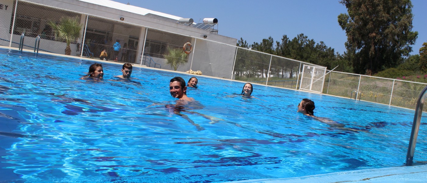 UNE Students swimming at the pool at the American School of Tangier