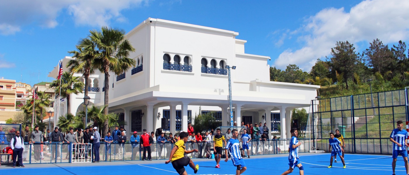 Playing soccer on UNE Tangier, Morocco Blue Sports Court