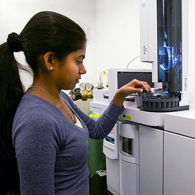 A Biological Sciences student working with biological research tech