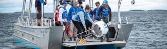 Students and faculty deploy a real-time shark detection buoy in Saco Bay