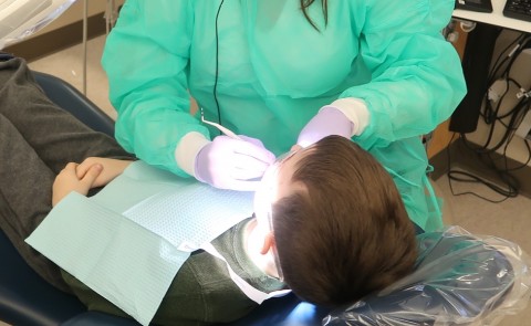 Dental student provides care to a child
