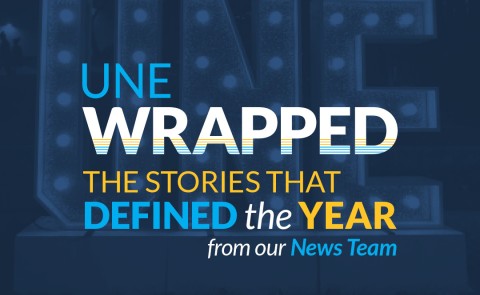 Graphic with writing saying "UNE Wrapped: The Stories That Defined The Year, from our News Team"