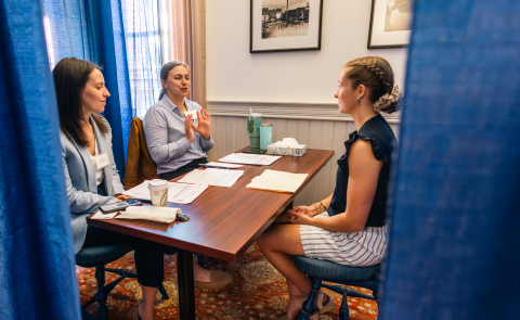 A Pharmacy student meets with prospective employers in a mock interview in Alumni Hall