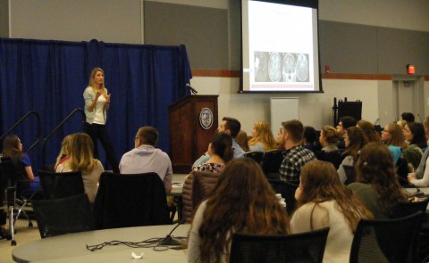 Kate Carlson, PharmD ’13, presents a case to UNE undergraduate students
