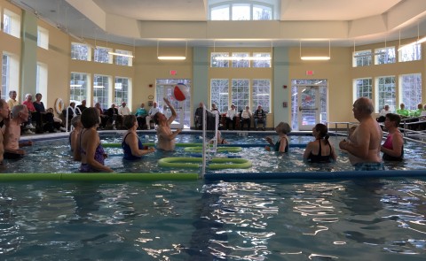 Older adults play water volleyball through U-ExCEL program