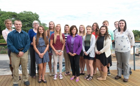 UNE President Danielle Ripich (front, center), Mitchell Institute President and CEO Meg Baxter (back row, second from left) and 