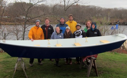 Members of the UNE Boatbuilding course pose with Sea Basket before the launch.