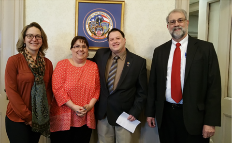 Caryn Husman, Cathy Dionne of the Autism Society of Maine, Councilor Robert Quattrone and Mayor Alan Casavant