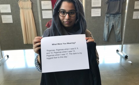 UNE student Hajra Chand helped organizers set up the 'What were you wearing' exhibit