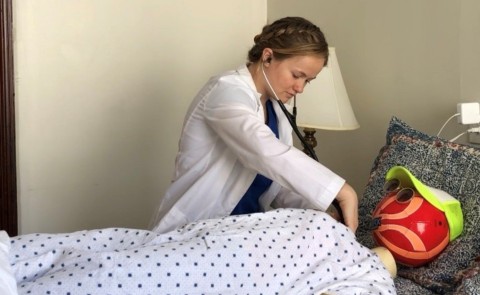 First-year physician assistant (PA) student Bailey D’Antonio performs a physical examination on her patient “Roxanne.” D’Antonio