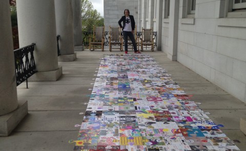 UNE graduate Glenn Simpson brought his recovery puzzle project to the Maine State House