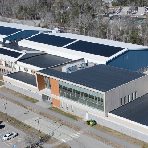 Aerial image of solar panels atop the Harold Alfond Forum