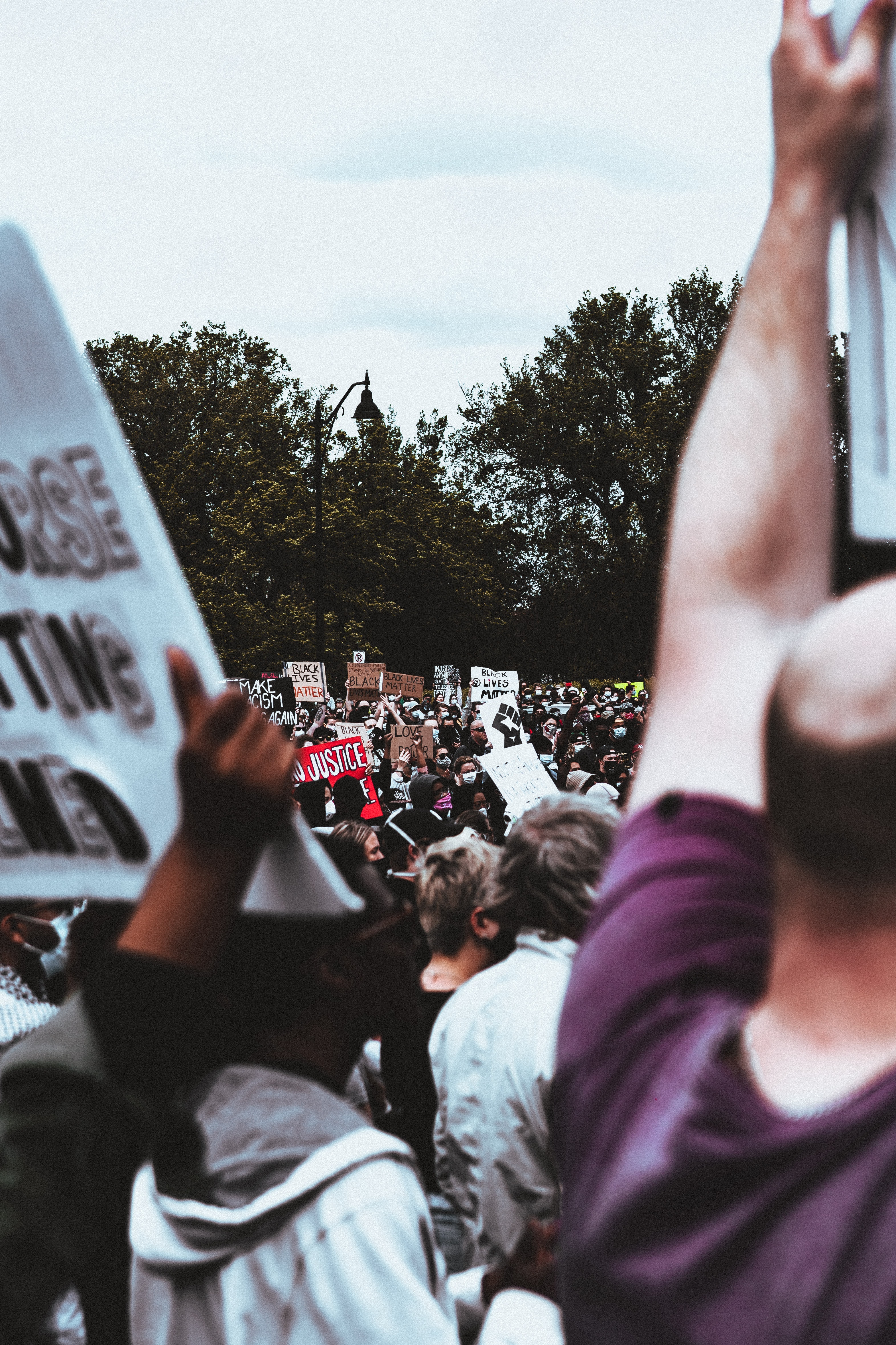 A crowd holds up signs at a Black Lives Matter protest