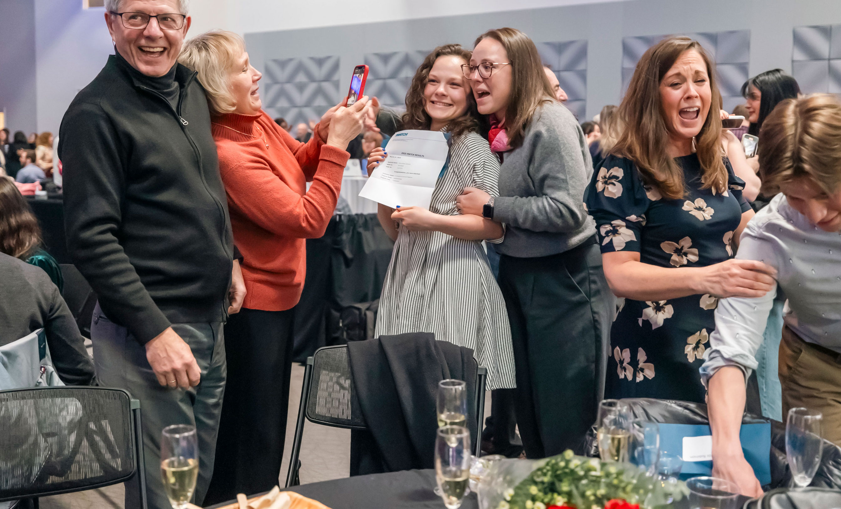 A medical student celebrates match results with her family
