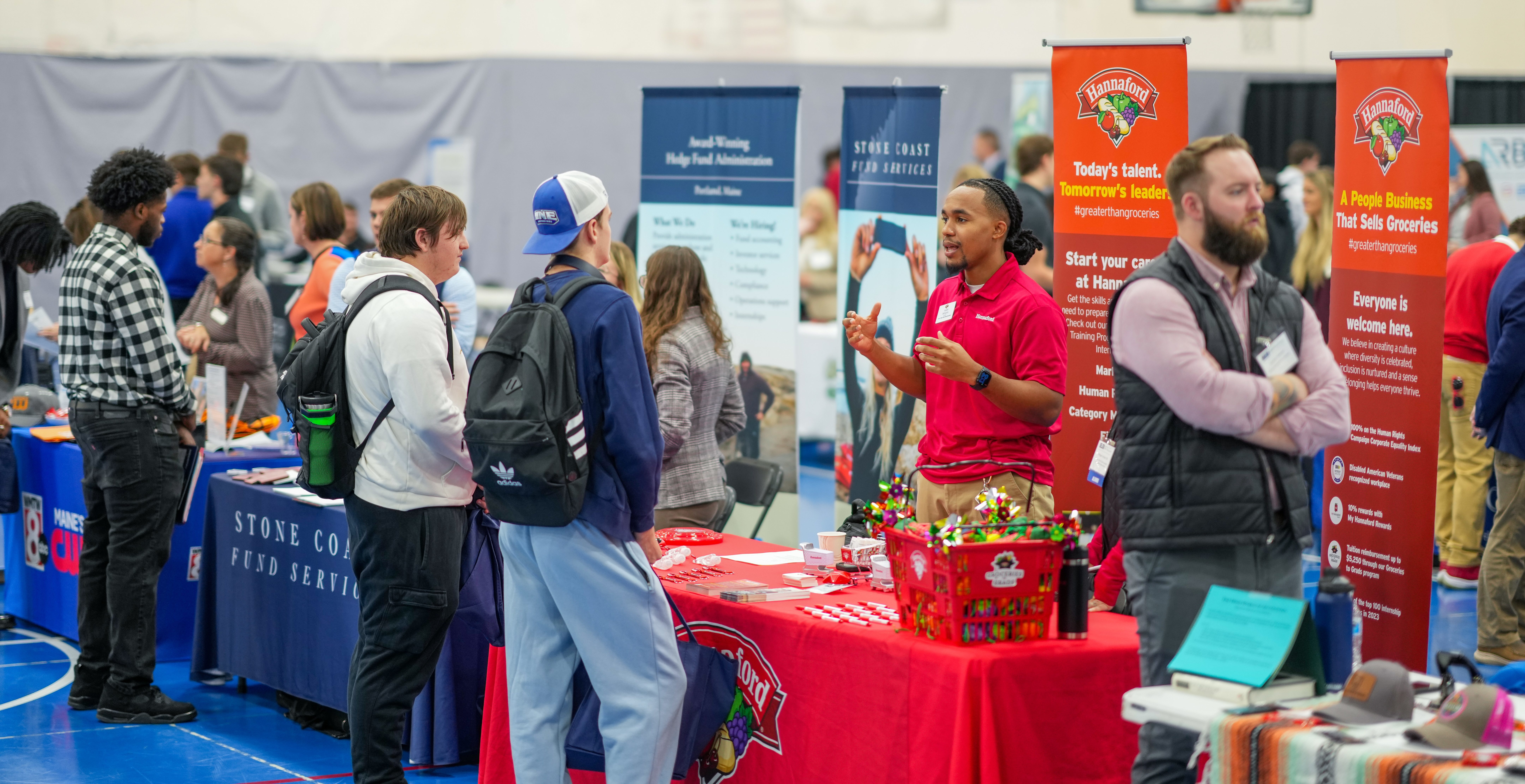 UNE students and employers talk at a career fair