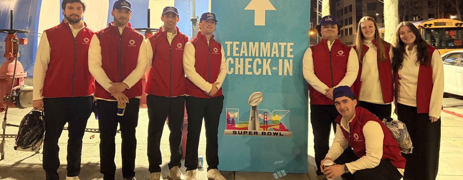 UNE business students pose in front of Levi's Stadium at Super Bowl LX