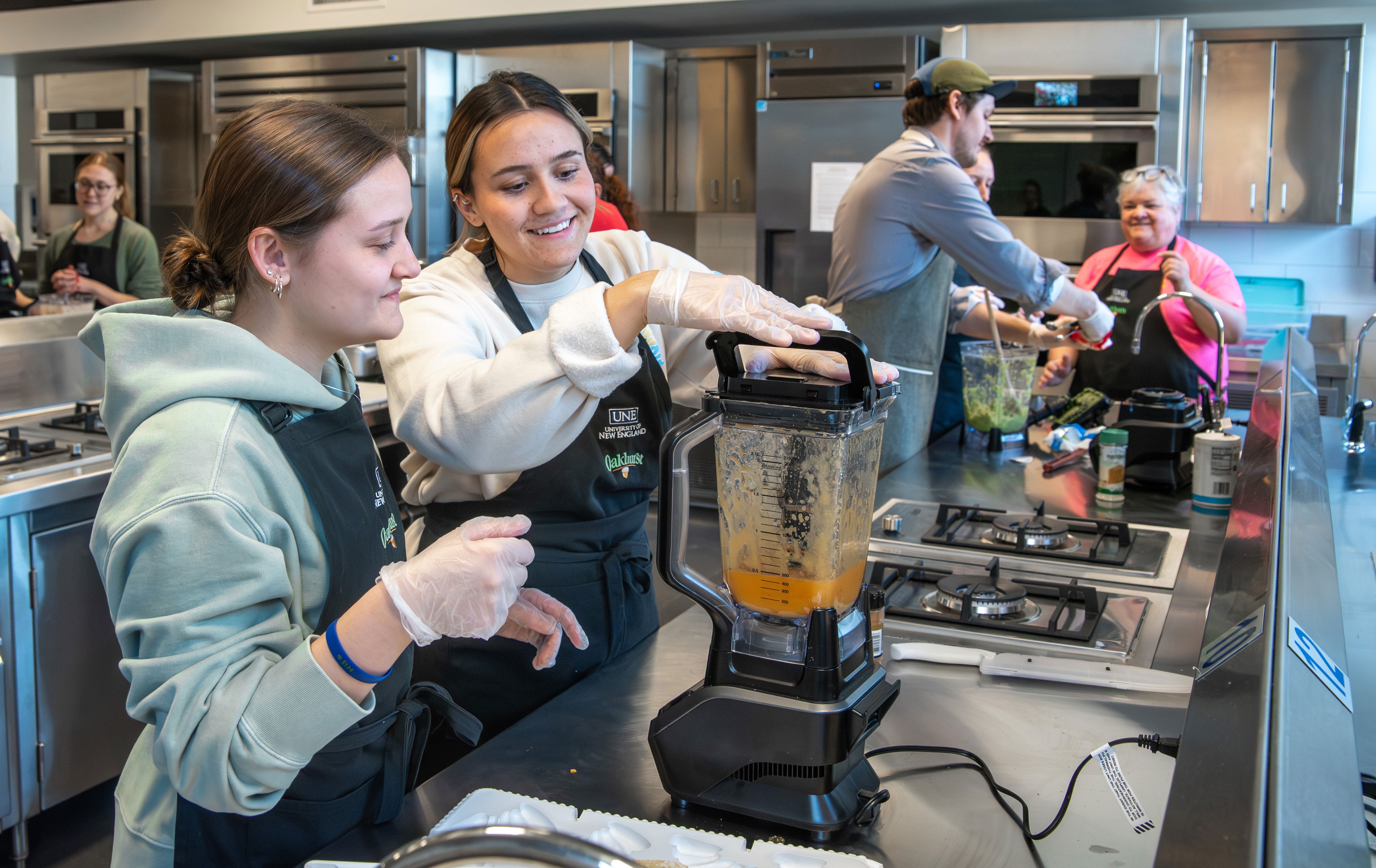 UNE occupational therapy students perform an exercise preparing blended foods for patients with limited swallowing capabilities