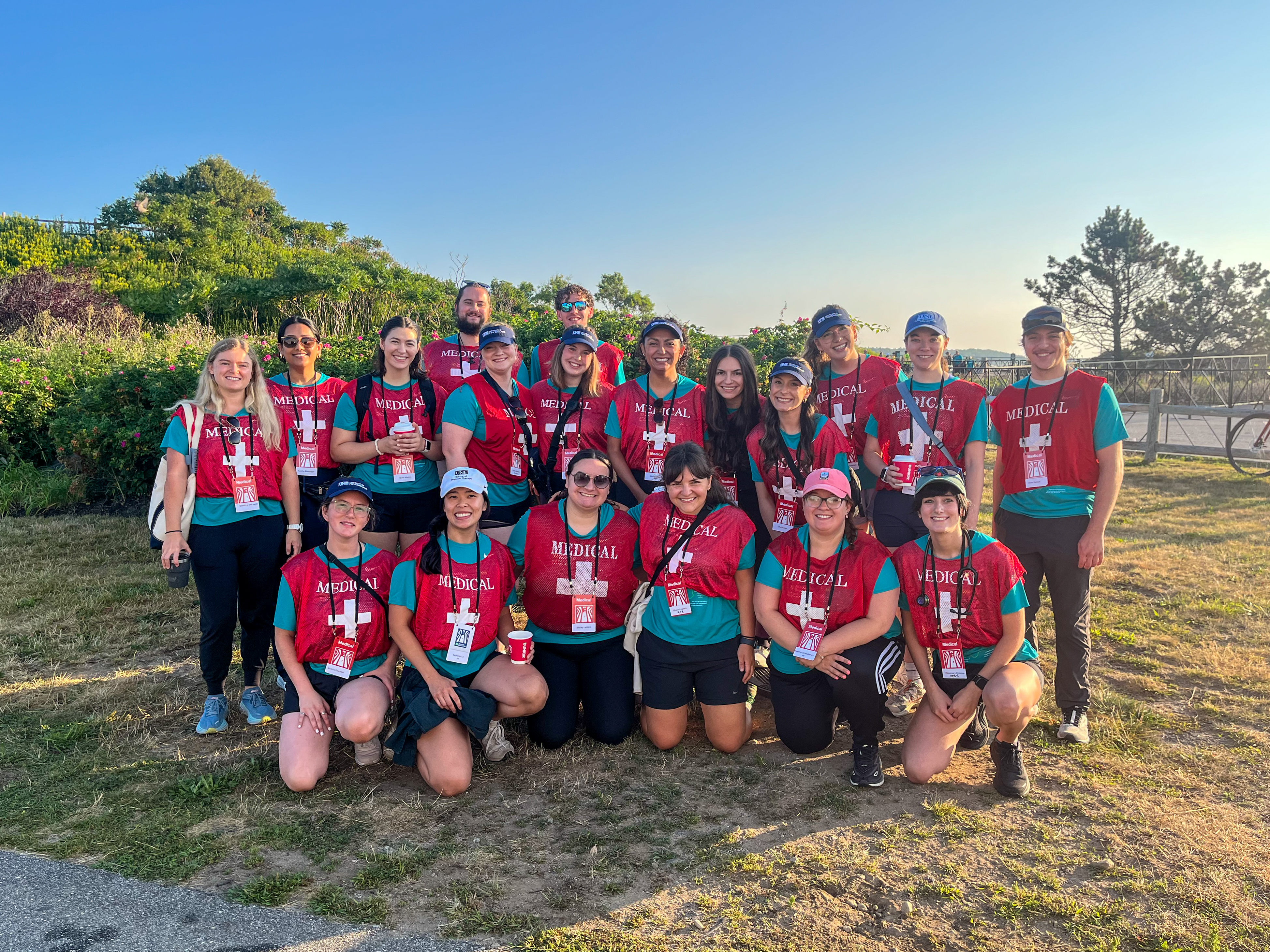 UNE students and volunteers pose at the Beach to Beacon finish line