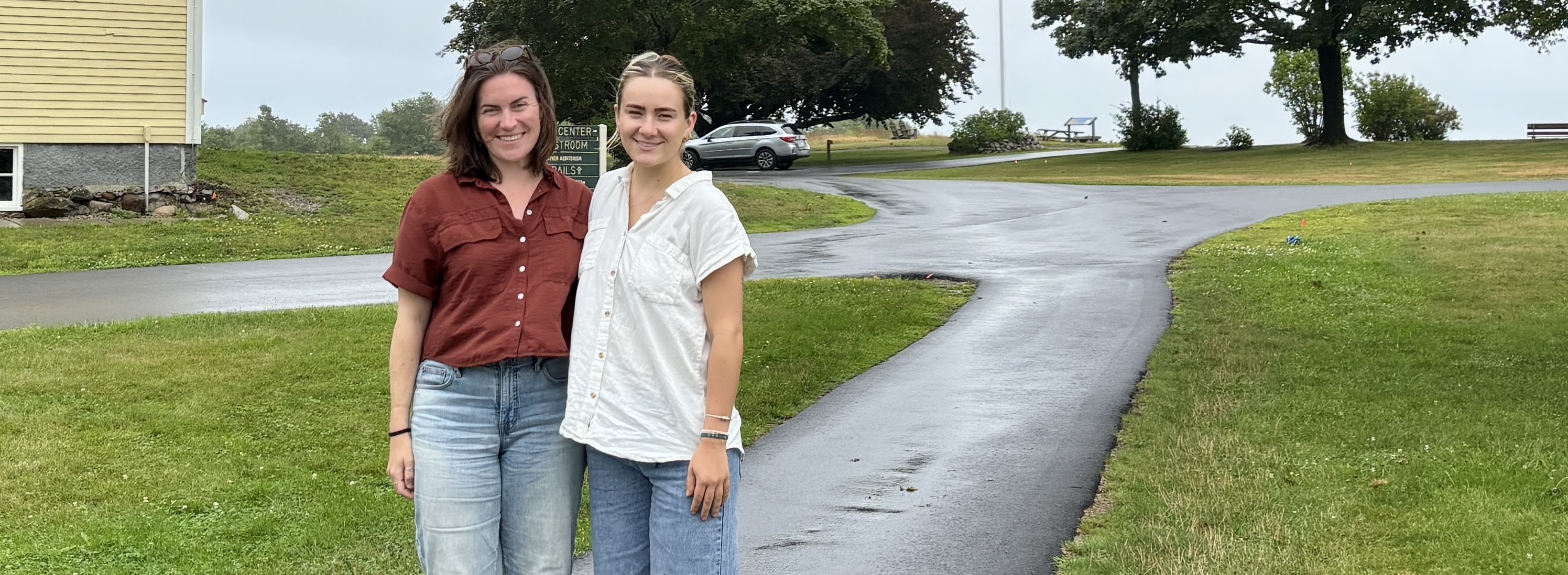 UNE student and mentor pose for outdoor photo