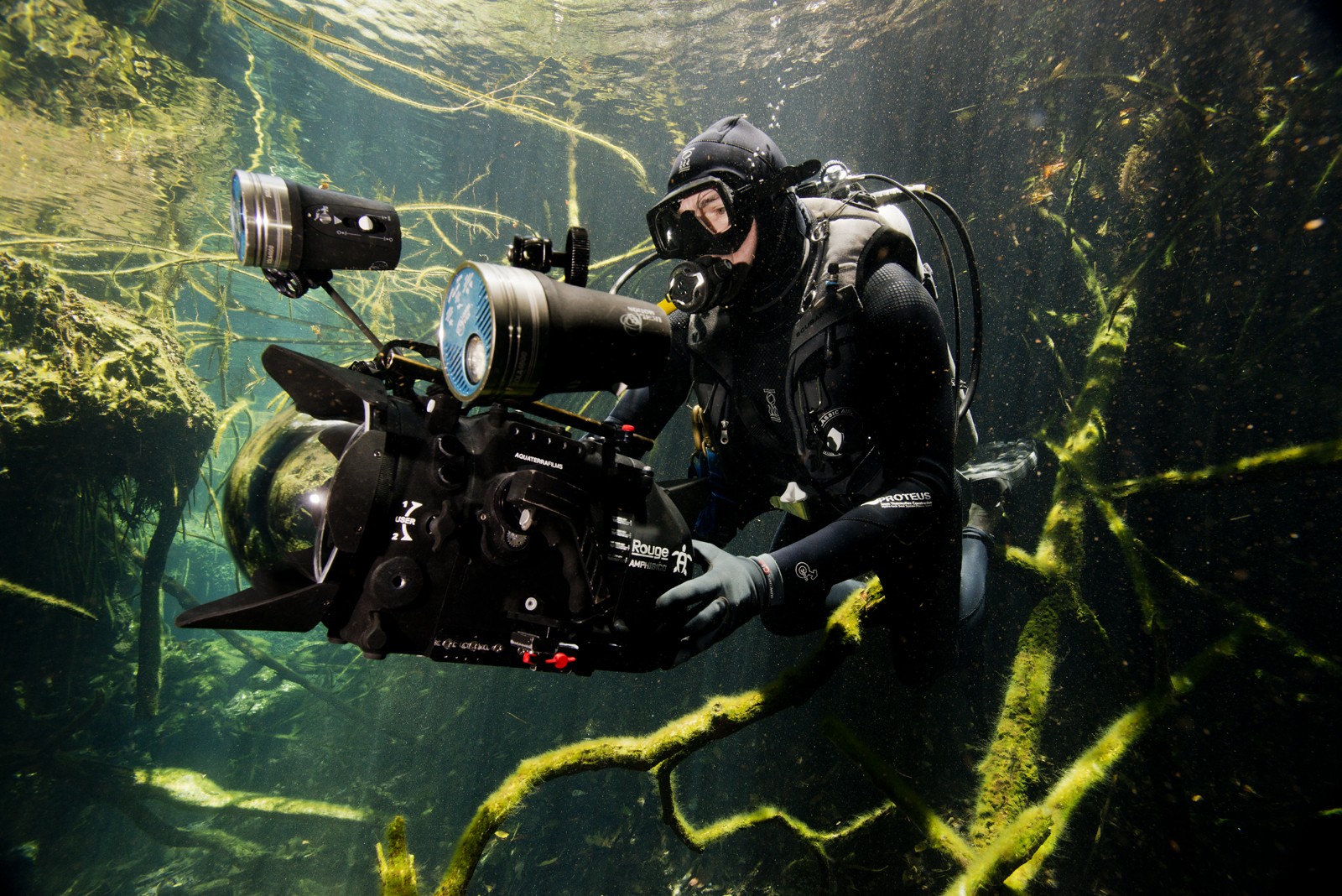 Underwater photo of cinematographer holding camera
