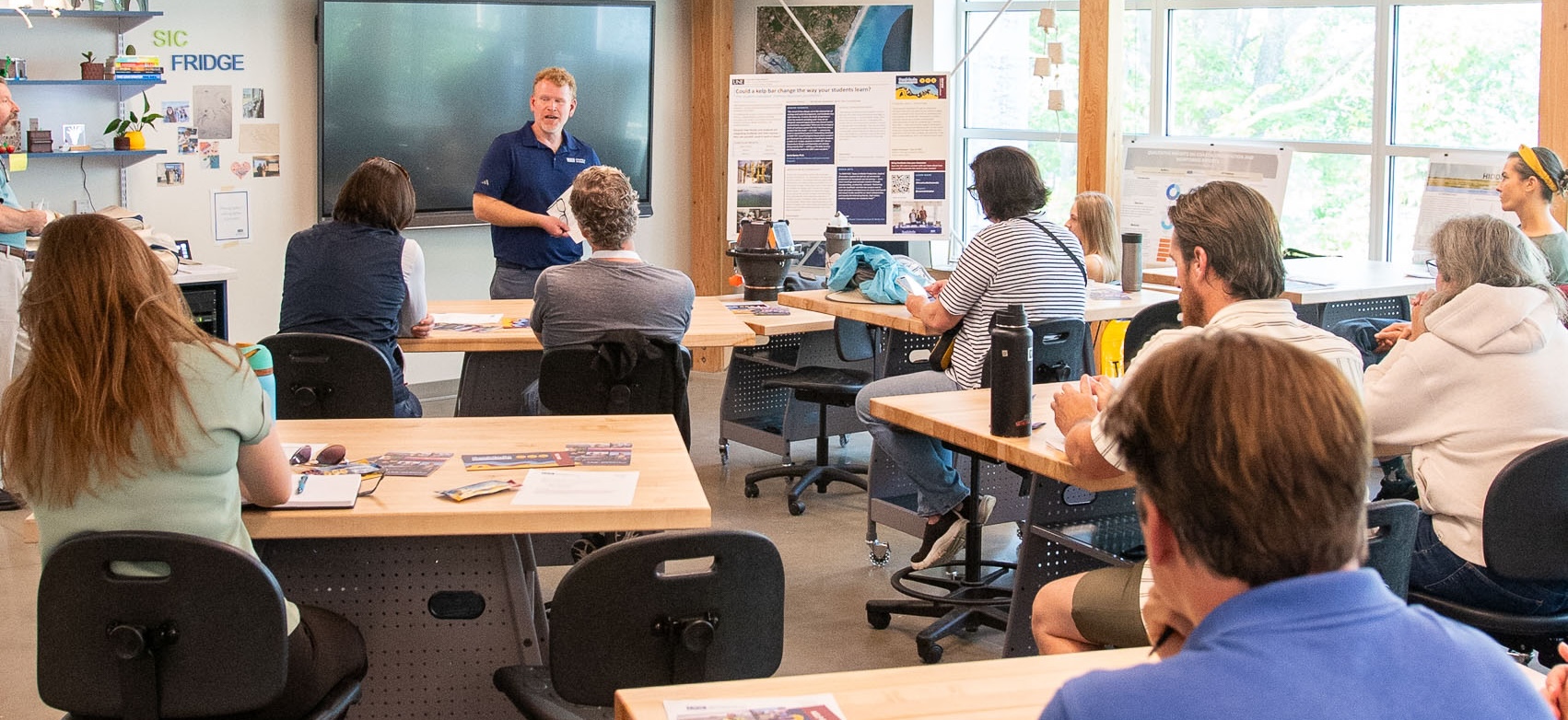 UNE professor Jeremy Pare speaks to a classroom