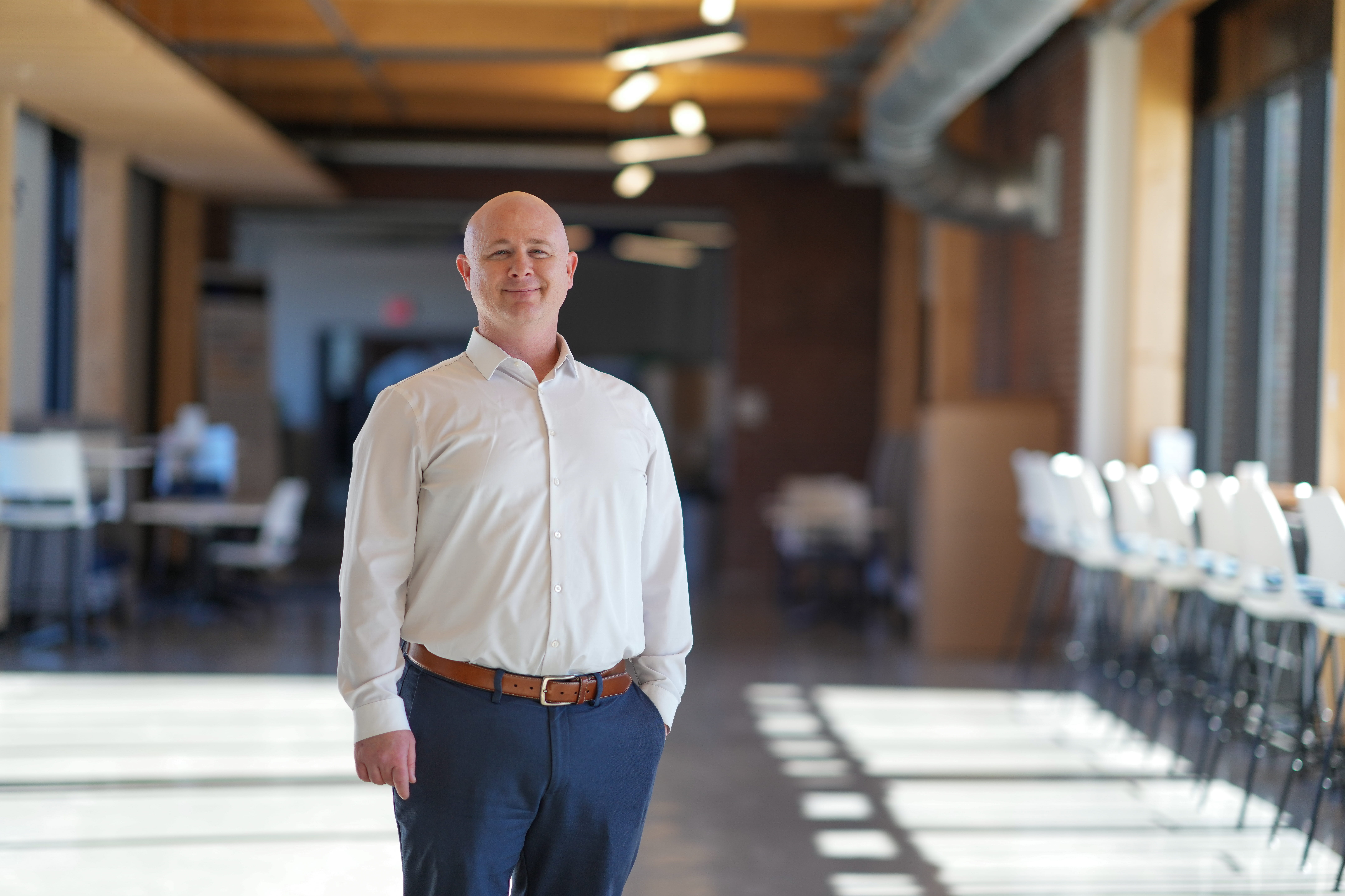 Scott Wood poses in the Harold and Bibby Alfond Center for the Health Sciences