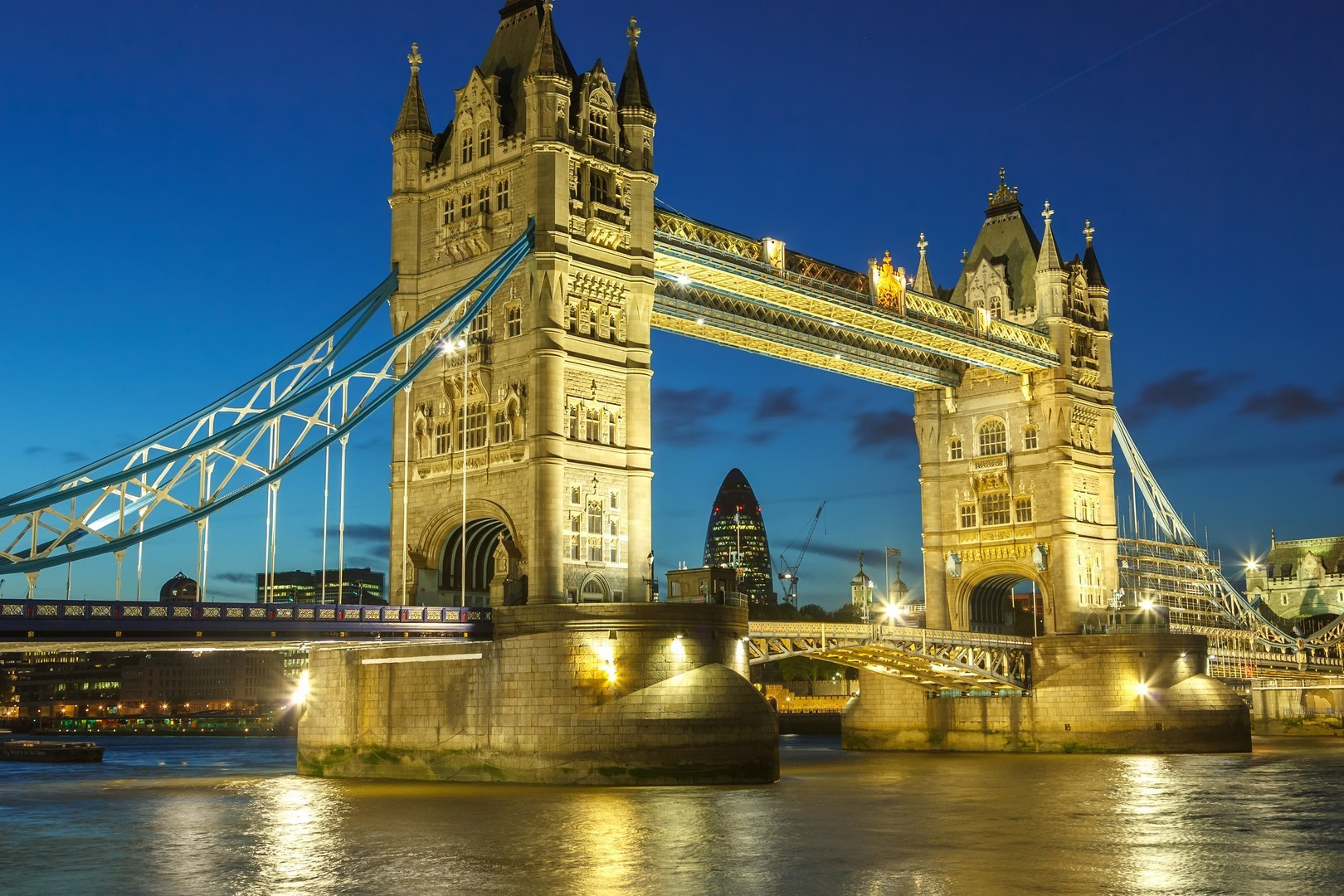 A lighted London bridge at night