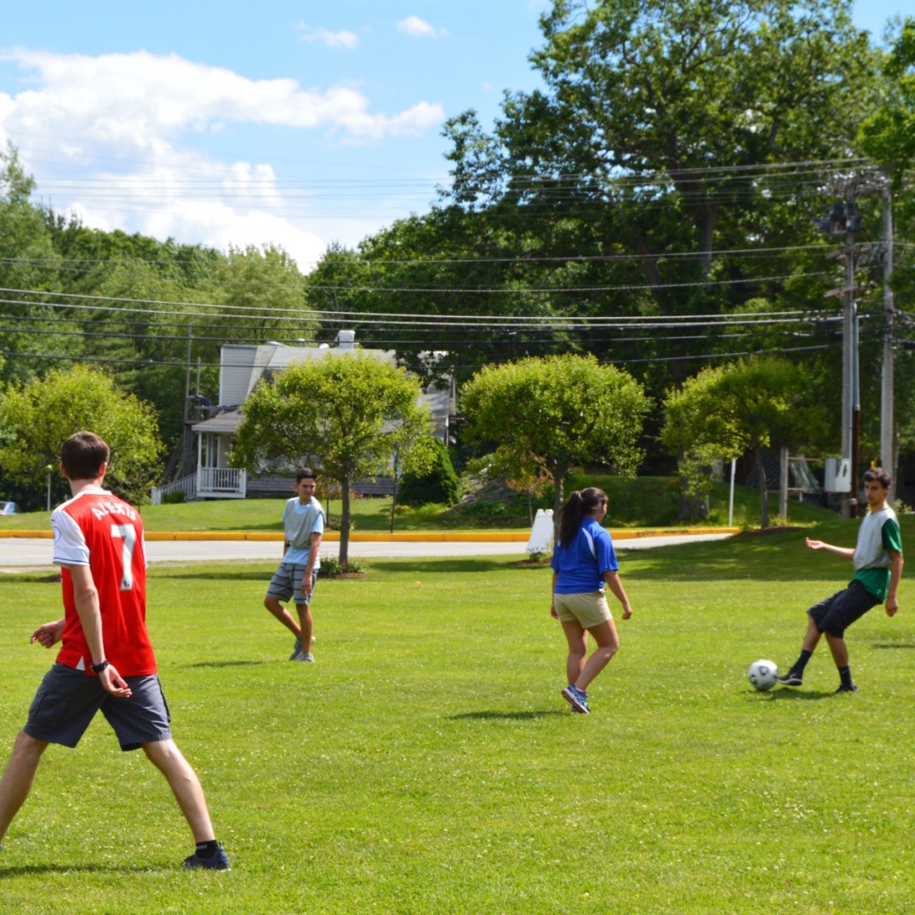 students play soccer outside