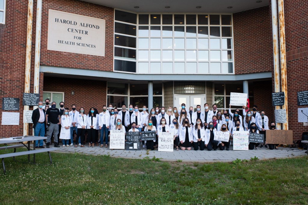UNE COM students pose following a demonstration for racial equity in health care 