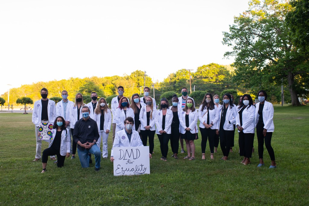 UNE College of Dental Medicine students pose with President James Herbert at the White Coats for Black Lives demonstration on Friday, June 12.