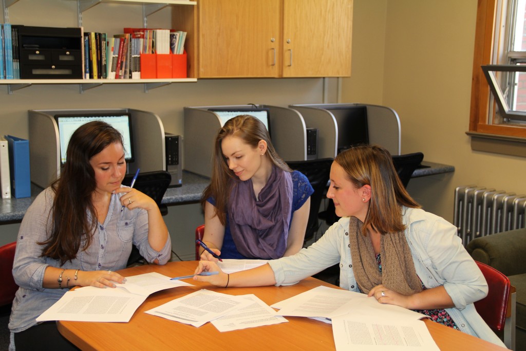 three students work in the psychology lab