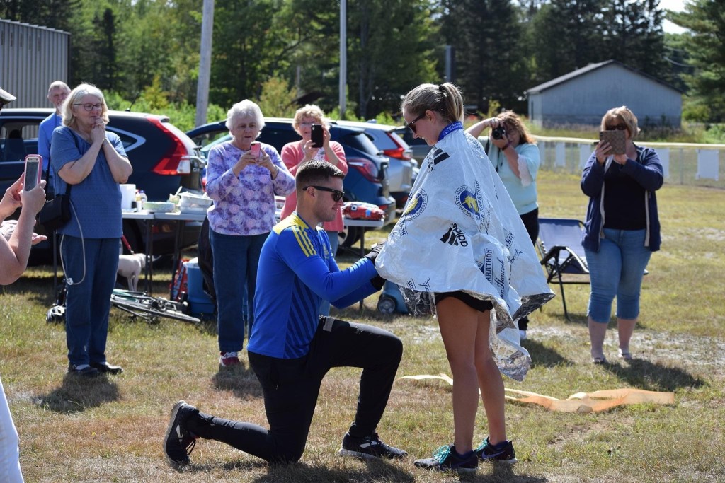 Thomas's partner, C.J. Vallie, proposes to her following her marathon finish.