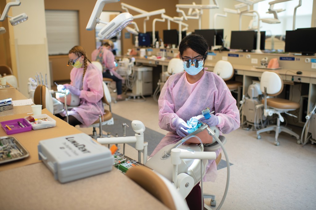 dental students practicing in the oral health center